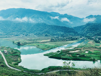 Aerial view of agricultural landscape against sky