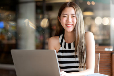 Young woman using mobile phone