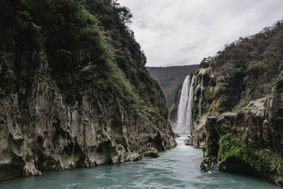 Scenic view of river flowing through rocks