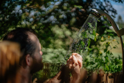 Portrait of man holding plants