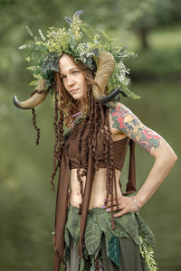 Portrait of young woman wearing traditional clothing standing outdoors