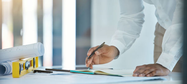 Midsection of man working at office