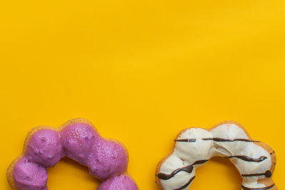 Close-up of stuffed toy against yellow background