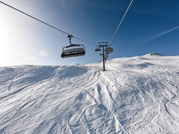 Overhead cable car on snow covered mountain