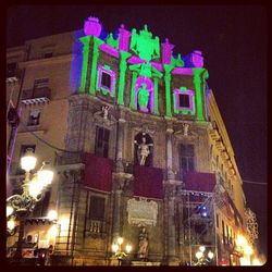 Low angle view of illuminated building at night