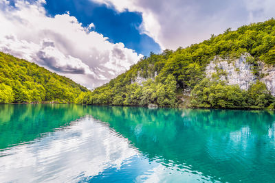 Scenic view of mountains reflection to turquoise water at plitvice lakes national park in croatia