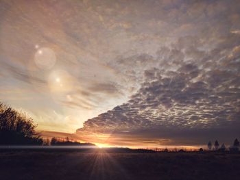 Scenic view of landscape against sky during sunset