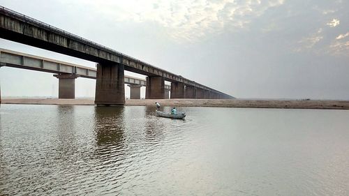 Bridge over river against sky