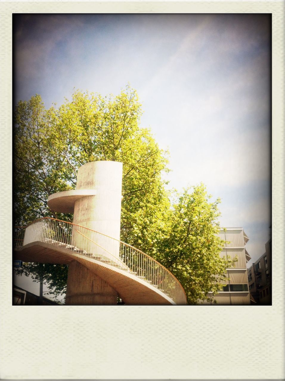 transfer print, auto post production filter, tree, built structure, architecture, low angle view, building exterior, growth, sky, day, no people, outdoors, plant, railing, nature, sunlight, green color, steps, clear sky, house