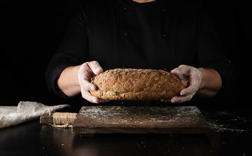 Midsection of man preparing food