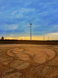 Scenic view of field against sky during sunset