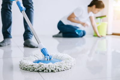 People cleaning floor at home