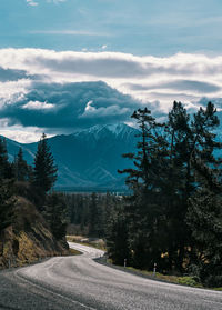 View of snowcapped mountain against cloudy sky