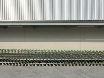 Shopping carts arranged against wall