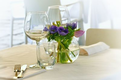 Flowers in glass on table