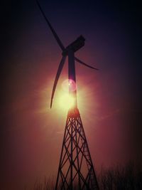 Low angle view of windmill against sky