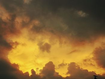 Low angle view of dramatic sky during sunset