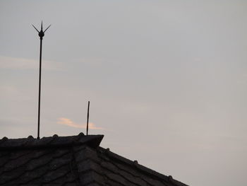 Low angle view of roof and building against sky