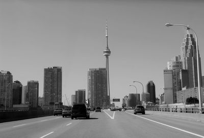 Modern buildings in city against clear sky with cn-rower toronto