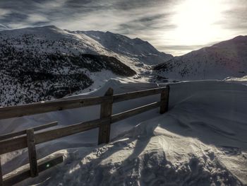 Scenic view of snow covered mountains against sky
