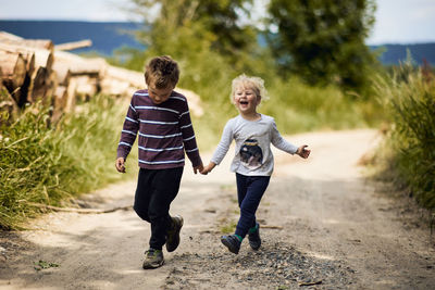 Full length of children on friends