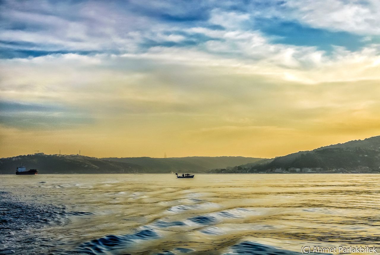 sunset, water, sky, tranquil scene, scenics, tranquility, cloud - sky, beauty in nature, sea, nature, beach, cloudy, idyllic, transportation, cloud, mountain, shore, silhouette, orange color, lake