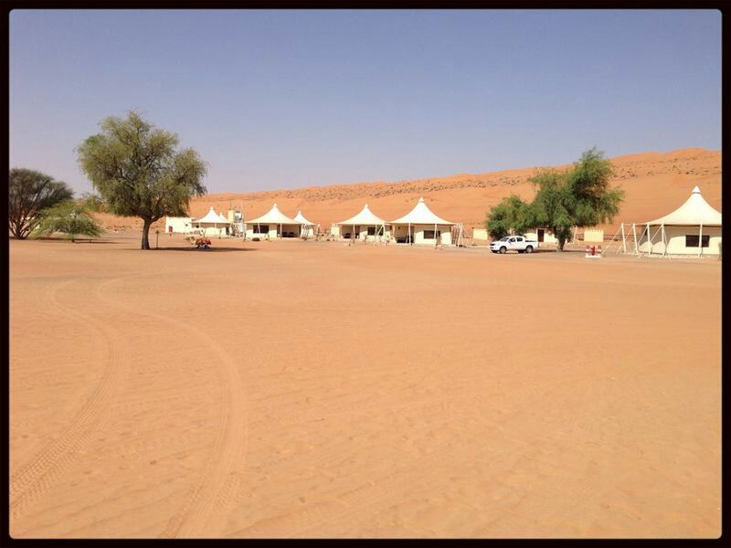 clear sky, built structure, architecture, building exterior, sand, house, copy space, blue, tree, sunlight, residential structure, beach, day, shadow, auto post production filter, transfer print, outdoors, town, landscape, no people