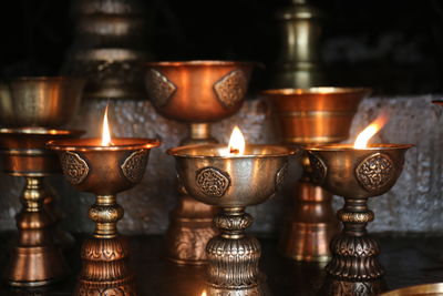 Close-up of illuminated tea light candle