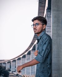 Side view of young man looking away