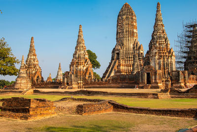 Temple by building against sky