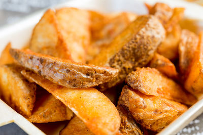 Close-up of fried potatoes in bowl