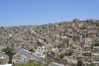 Aerial view of city against clear sky