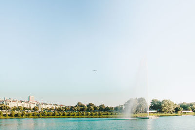 Panoramic view of lake and buildings against sky