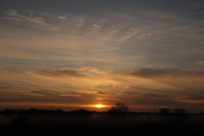 Scenic view of silhouette landscape against sky during sunset