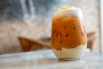 Close-up of orange juice on table