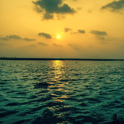 Scenic view of sea at sunset