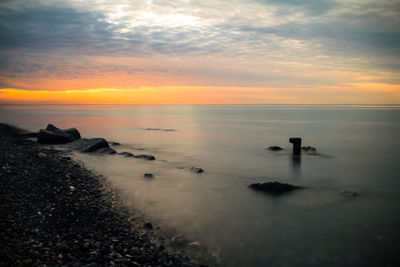 Scenic view of sea against sky during sunset