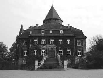 Low angle view of linnep castle in black and white 
