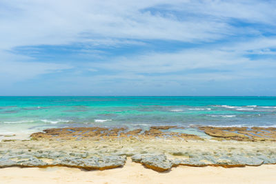 Scenic view of beach against sky