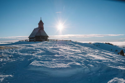 Scenic view of snow covered mountain against sky