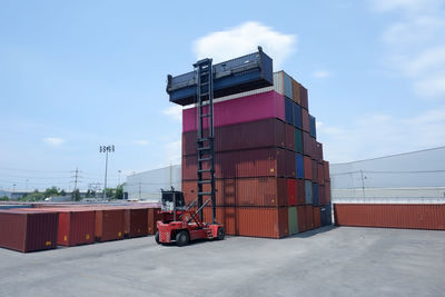 Stack of red house against sky