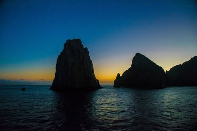 Scenic view of sea against sky at sunset