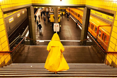 High angle view of man walking on escalator