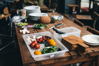 High angle view of fruits and vegetables in container on table