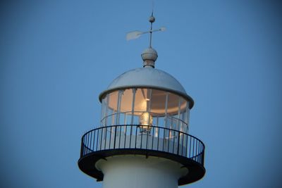 Low angle view of lighthouse against clear blue sky