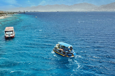 High angle view of sailboat sailing on sea against sky