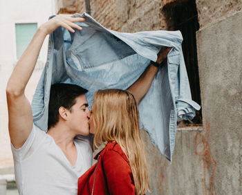 Young couple kissing in traditional clothing