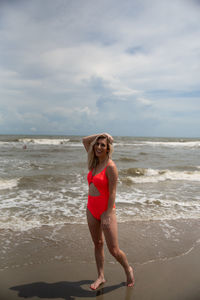Full length of young woman on beach