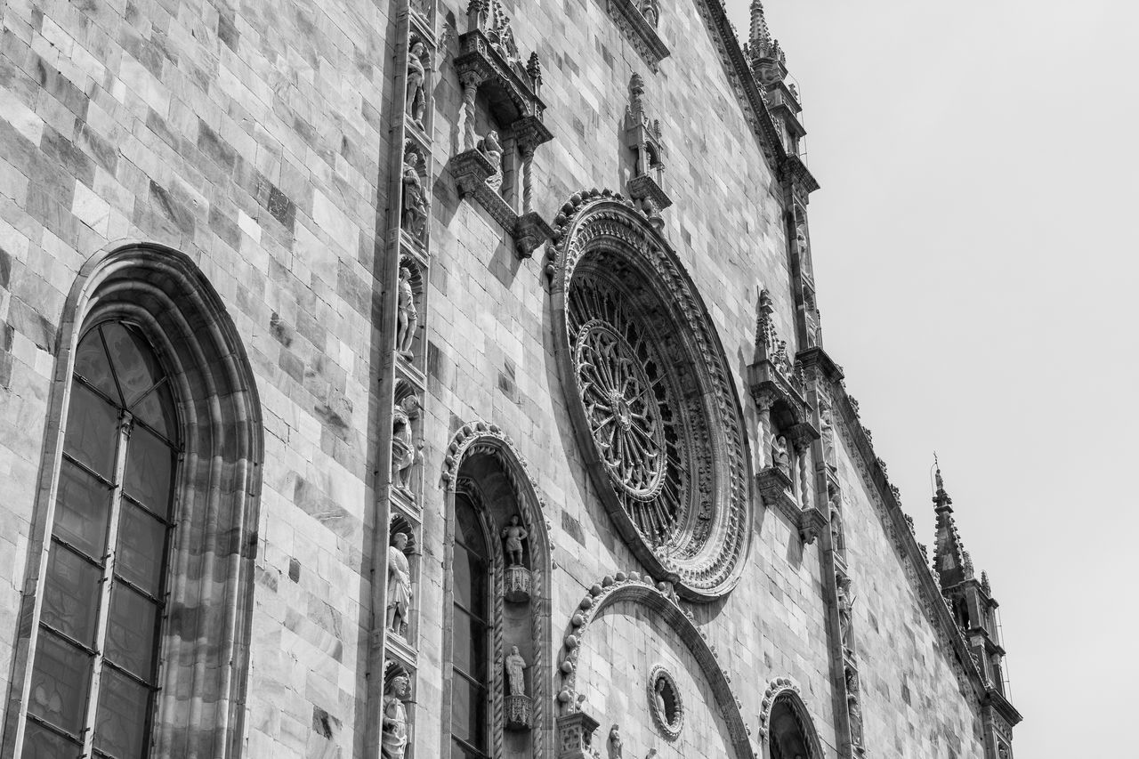 architecture, built structure, building exterior, low angle view, black and white, place of worship, building, religion, monochrome, monochrome photography, belief, history, the past, spirituality, no people, travel destinations, day, arch, worship, white, sky, catholicism, tower, window, outdoors, travel, nature, tourism, city, black, facade