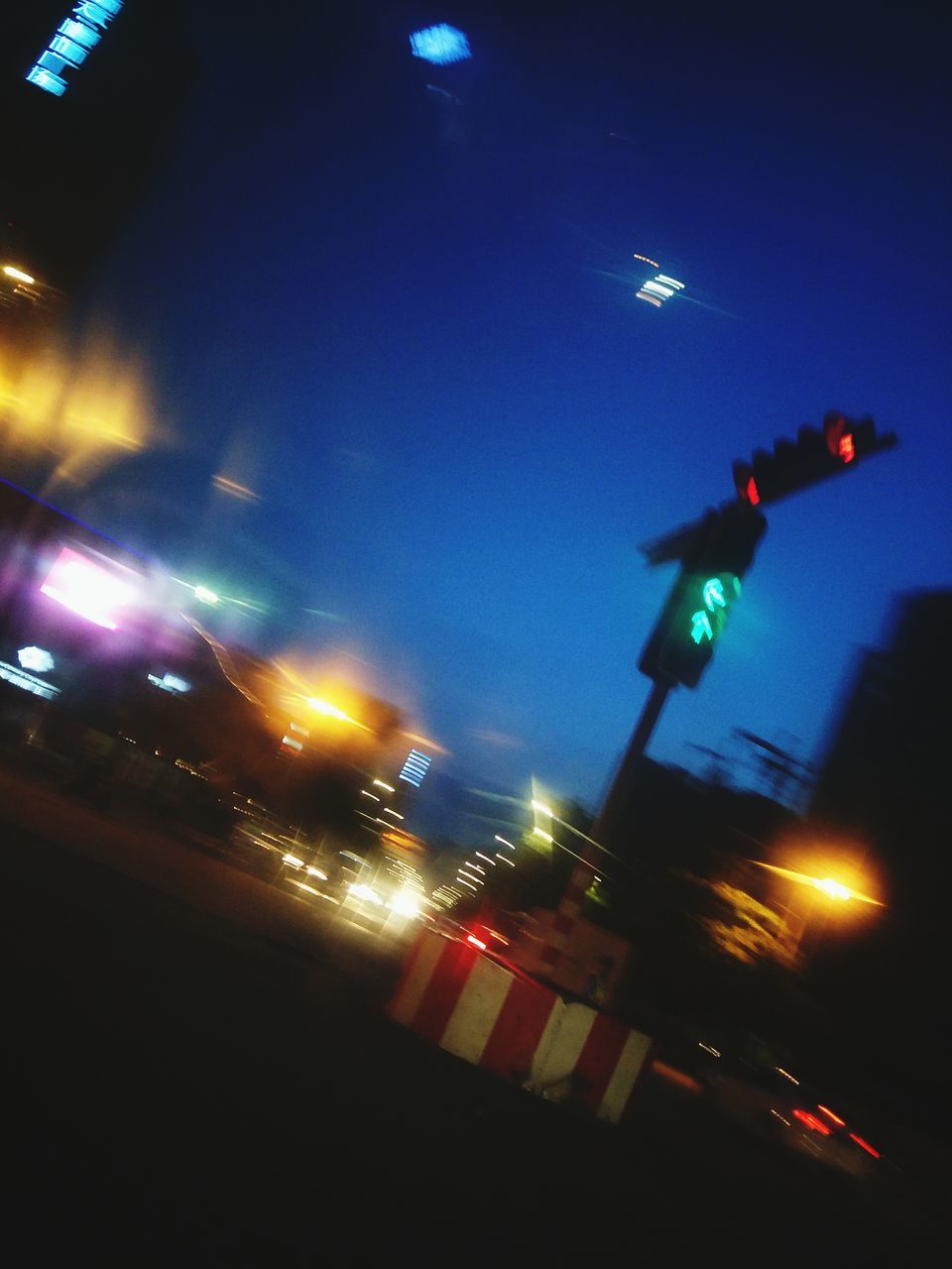 illuminated, night, stoplight, blurred motion, red light, transportation, low angle view, no people, outdoors, motion, road sign, city